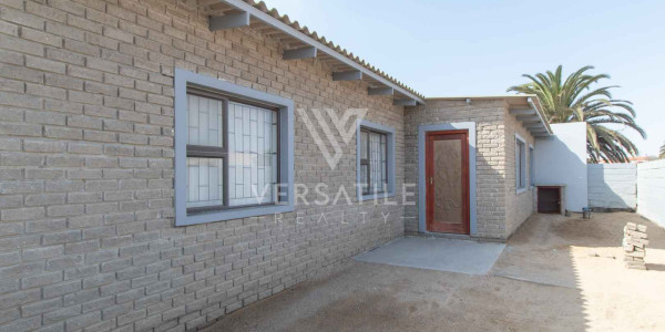 3-Bedroom family home with two self-contained bachelor units.
