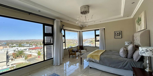 Experience modern elegance in the heart of Windhoek. Ideal for discerning homeowners. Presented by Agent Melany.