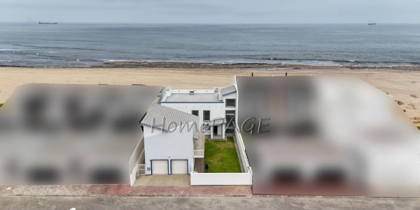 Dolphin Beach:  Spacious Beachfront home in Eco Village is for Sale