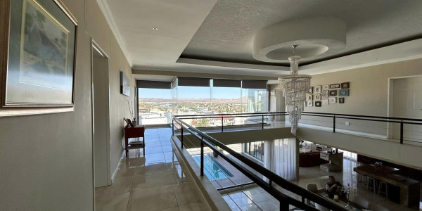 Experience modern elegance in the heart of Windhoek. Ideal for discerning homeowners. Presented by Agent Melany.