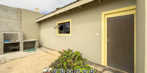 4-bedroom house with a 2-bedroom flat for sale