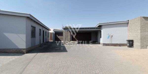 3-Bedroom family home with two self-contained bachelor units.