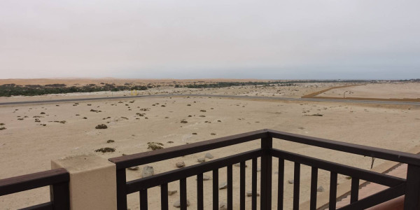 A true desert rose! Elegant warm house with endless dune views